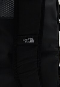 The North Face BASE CAMP DUFFEL S UNISEX - Cestovná taška - black/white