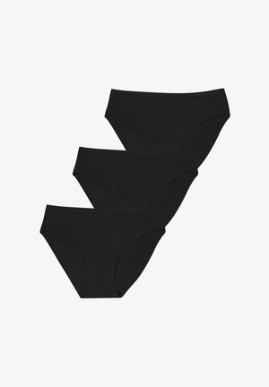 Trois culottes de femme de style bikini noires sans couture empilées sur un fond blanc.