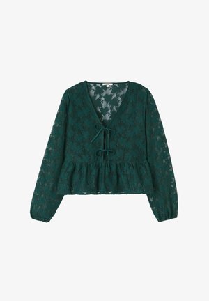 Blouse en dentelle vert foncé à manches longues avec motif floral, encolure en V, deux liens à nouer à l'avant et ourlet à basque.