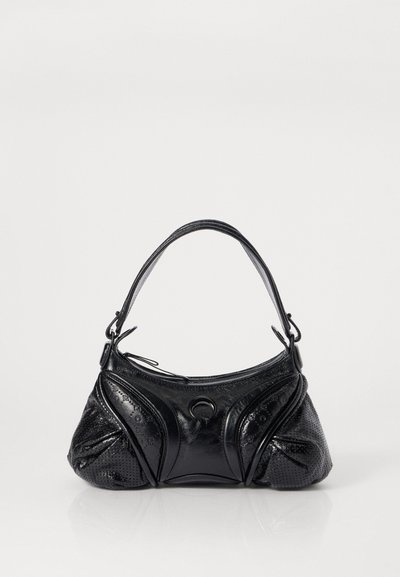 Black handbag made of textured leather with a rounded shape. Features a thin shoulder strap and decorative embossed patterns.