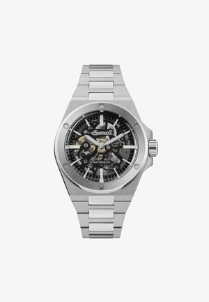 Automatische roestvrijstalen horloge met een zwart skelet dial, zilveren uurmarkeringen en een gepolijste armband. Beschikt over een ronde kast.