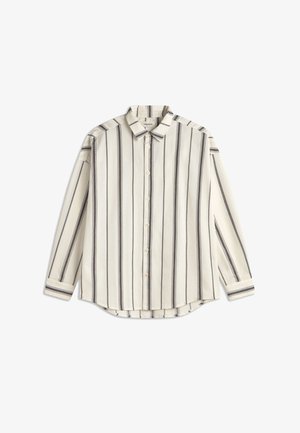 Chemise à manches longues à boutonnage crème avec des rayures verticales noires. Présente un col classique, un ourlet droit et des poignets boutonnés. Matière en coton.