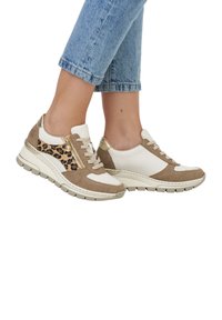 Chunky sneakers featuring a beige suede upper with white leather accents and leopard print side panel, finished with a textured rubber sole.