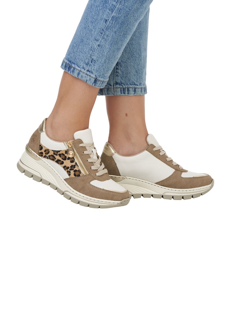 Chunky sneakers featuring a beige suede upper with white leather accents and leopard print side panel, finished with a textured rubber sole.