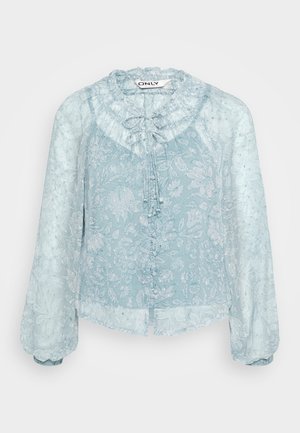 Light blue, floral patterned blouse with a ruffled neckline, long puff sleeves, and button closure at the front. Transparent fabric.