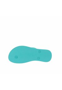 Plantilla de zapato de goma turquesa con superficie texturizada y forma definida, que presenta dos cavidades circulares para soporte o sujeción.