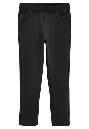 Pantaloni de tip leggings negri, cu un brâu elastic, două buzunare laterale și accente volă deoarece la marginea buzunarelor. Textură de țesătură netedă.