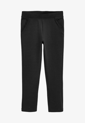 Schwarze Stretchhosen mit einem elastischen Bund, zwei Seitentaschen und rüschierten Akzenten entlang der Taschenränder. Glatte Stoffoberfläche.