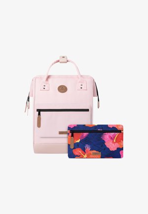 Pink fabric backpack with adjustable handles, front zip pocket, and a colorful floral-patterned pouch with a zip closure.