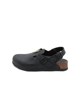 Black leather clog with adjustable straps, a cork footbed, and textured surface. Features a solid heel and rubber sole for grip.