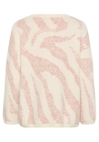 Krämfärgad tröja med ett mjukt, texturerat tyg och ett rosa zigzag-mönster, sänkt axelstuk och ribbade mudd och nederkant.