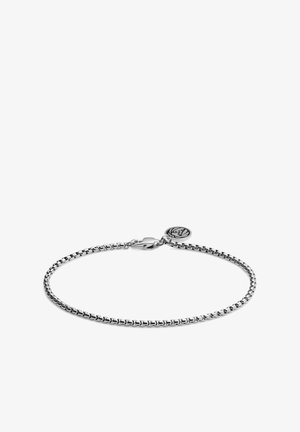 Silver bracelet featuring a chain design, with a lobster clasp and a round charm displaying an embossed logo. Smooth metallic finish.