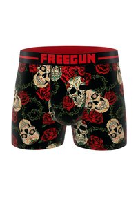 Un boxer avec un fond noir décoré d'un motif de roses rouges et de crânes peints, terminé par une ceinture rouge portant l'inscription "FREEGUN".