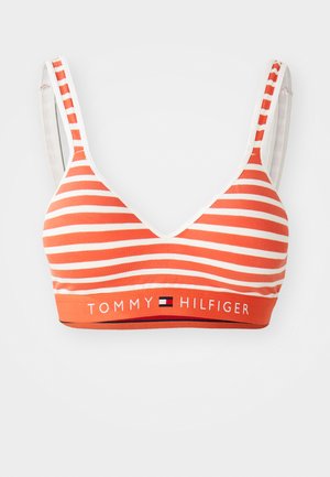 Orange and white striped bralette with a v-neck design, adjustable straps, and a branded elastic band featuring "TOMMY HILFIGER."