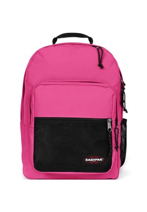 Pink backpack with a black mesh front pocket, durable fabric, zip closures, and a top handle. Features adjustable shoulder straps.