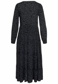 Schwarzes Kleid mit Punkten und langen Ärmeln, gefertigt aus weichem Stoff. Es hat einen runden Halsausschnitt und ein dezentes Tiermuster.