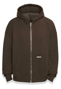 Hoodie zippé marron en tissu doux. Dispose d'une capuche spacieuse, de poches avant, de manches côtelées et d'une petite étiquette près de l'ourlet.