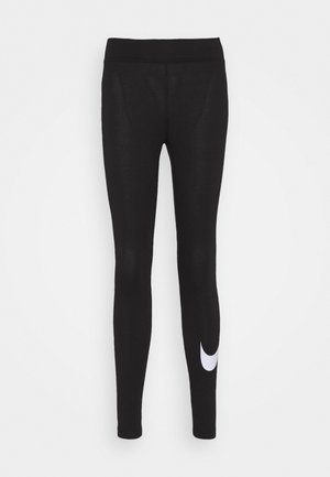 Zwarte leggings met een aangesloten silhouet, gemaakt van rekbare stof. Voorzien van een wit Nike-logo op de onderkant van het linkervoorbeen. Glad van textuur.