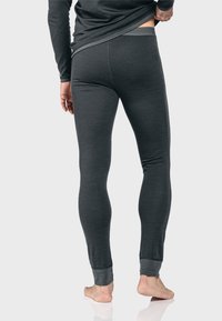 Graue thermische Leggings aus weichem Stoff, mit engem Sitz, schmal zulaufenden Beinen und kontrastierenden Bündchen an den Knöcheln. Minimalistisches Design.