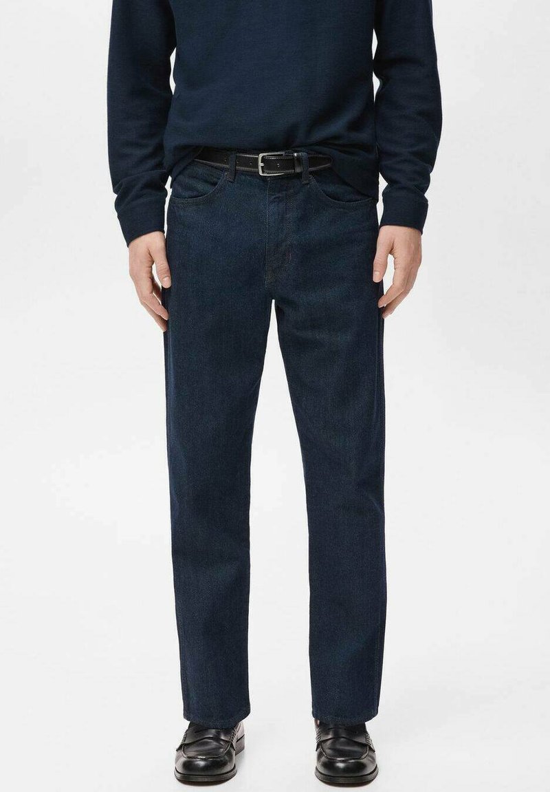 Navy blue denim jeans with a straight fit, five pockets, and a zip fly, paired with a black belt and black shoes. Smooth texture.