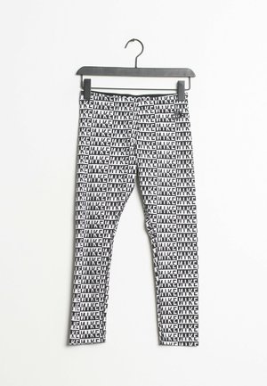 Black and white leggings with repeating bold text pattern "MIKE" hanging on a black hanger against a white background.