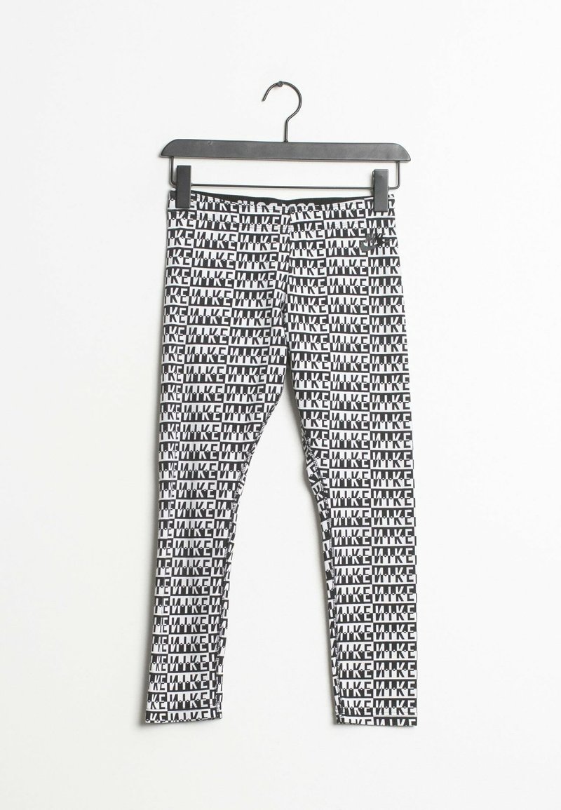 Leggings noir et blanc avec un motif de texte en gras répétitif "MIKE", suspendus à un cintre noir sur fond blanc.