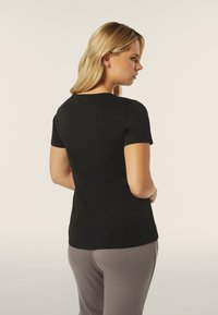 Freddy COMFORT FIT CON GRAFICA COMPOSTA DA STRASS - Camiseta estampada - nero