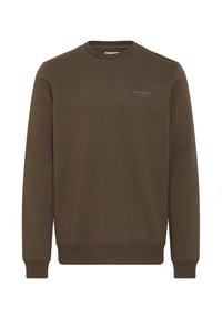 Sudadera de cuello redondo marrón hecha de una tela suave. Presenta mangas largas, puños acanalados y un detalle de texto en la parte frontal. Diseño sencillo y de corte relajado.