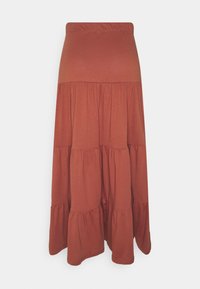 Jupe maxi en coton doux de couleur rouille, avec des niveaux superposés. Elle dispose d'une taille élastique et de volants froncés à l'ourlet.
