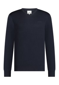 Marineblauwe v-halstrui van gladde stof, met ribgebreide manchetten en zoom. Subtiele branding op de borst. Lange mouwen, klassieke pasvorm.