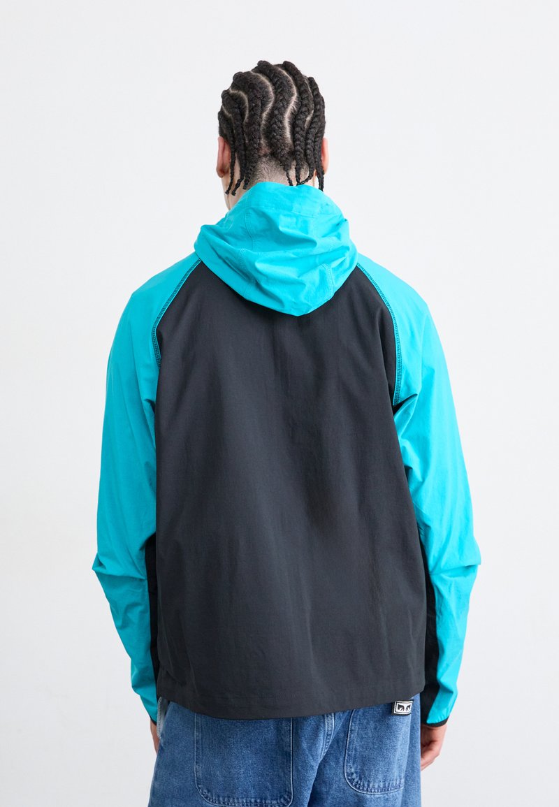 Nike Sportswear Windbreaker - dusty cactus/black/trkis - Zalando