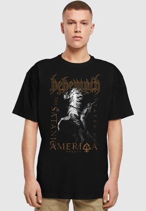 Black cotton t-shirt featuring a graphic design of a horse and rider, with gold text reading "Behemoth, The Satania States Ov America."