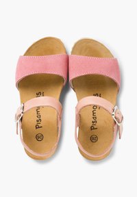 Pink suede sandals with wide straps and buckle closure. Cork footbed provides cushioning. Smooth, light leather accents.