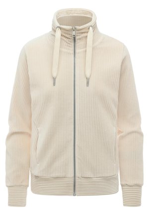 Beige ribstrikket jakke med lynlås, høj krave, snore, lange ærmer og ribstrikkede manchetter og kant.