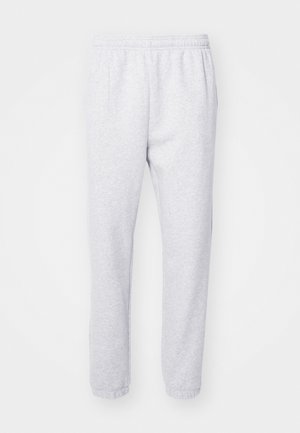 Lichtgrijze joggingbroek gemaakt van een zachte katoenmix, met een elastische tailleband en aansluitende boorden bij de enkels. Geen zichtbare patronen of logo's.