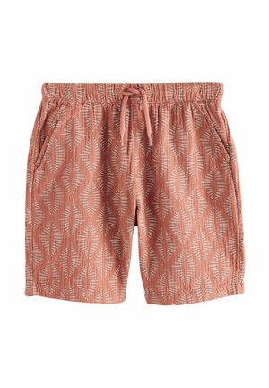Shorts rouges à motifs, fabriqués en tissu doux. Dotés d'une taille élastique avec cordon de serrage, d'un motif de feuilles vertical et de poches latérales.