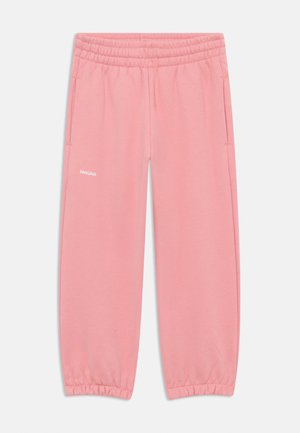 Pink sweatpants with an elastic waistband, featuring side pockets and a small white logo on the left leg, made from soft fabric.