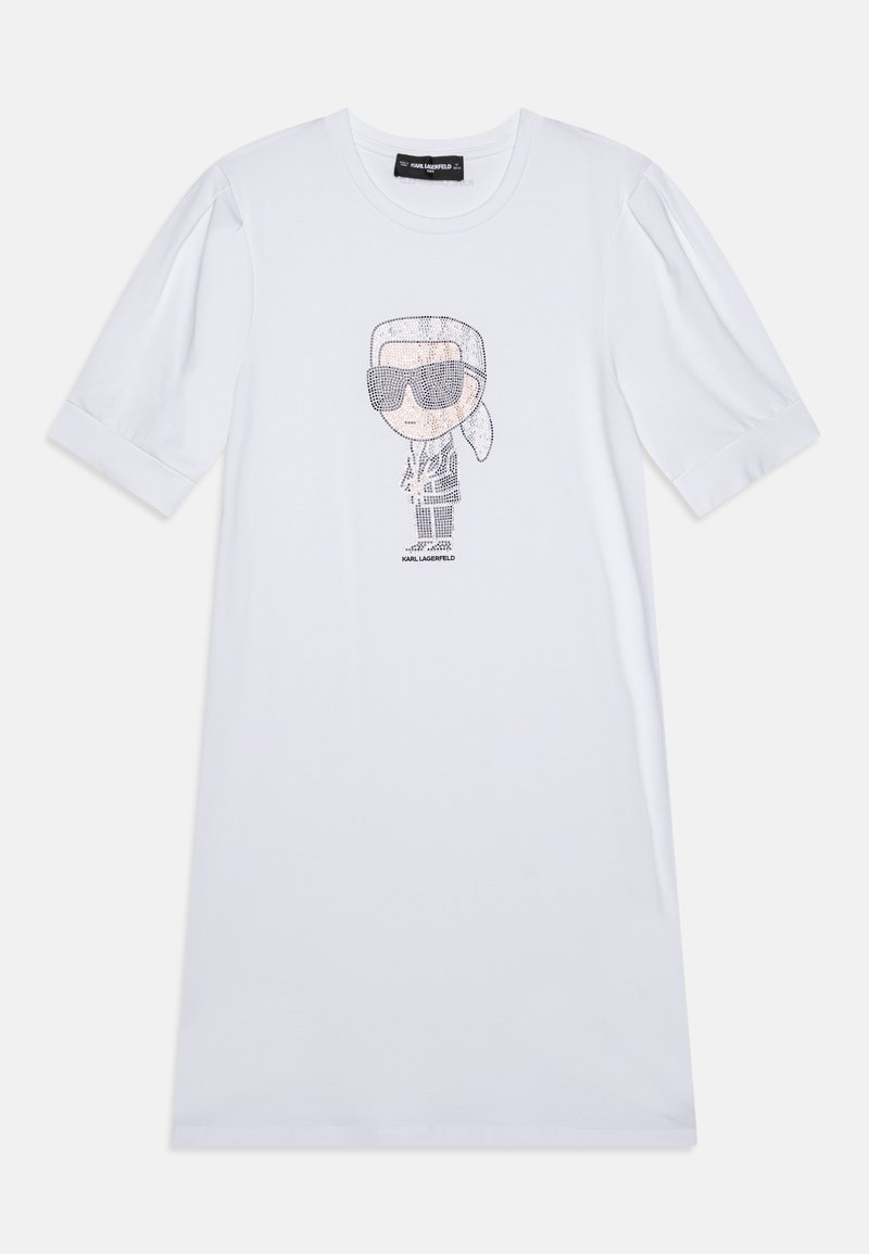 Vestido t-shirt em algodão branco com uma ilustração de cartoon com óculos de sol. Mangas bufantes curtas e um corte solto. Textura suave, design simples.