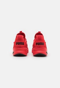 Puma ENZO EVOLVE - Zapatillas running asfalto - high risk red/black