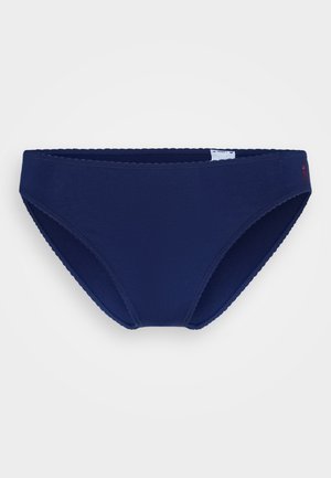 Tamsiai mėlynos bikinio kelnaitės, pagamintos iš lygaus audinio su banguotais kraštais. Šonėje yra mažas logotipas, o kirpimas yra klasikinis.