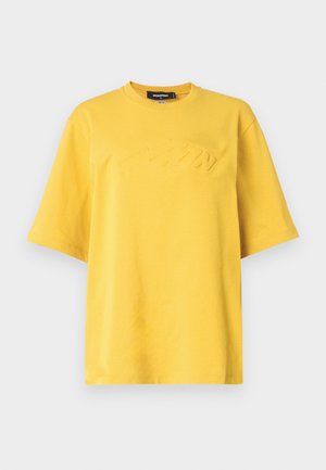 Yellow cotton t-shirt with a crew neck, short sleeves, and embossed logo detail on the front. Soft texture and relaxed fit design.