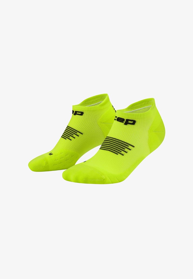 Pair of neon yellow low-cut athletic socks with black branding and stripe details on white background.