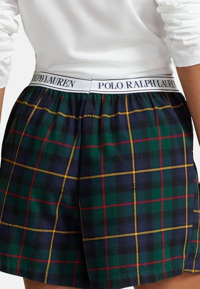 Kraťasy s károvaným vzorem na tmavě modrém podkladu se zelenými, červenými a žlutými pruhy. Elastický pas s detailem loga "POLO RALPH LAUREN".