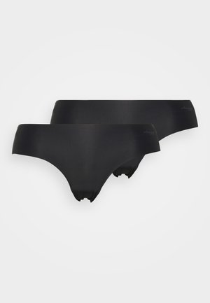 Sorte sømløse truser laget av glatt stoff, med lav midje-design og elastisk midjebånd. To par vist uten synlige logoer.