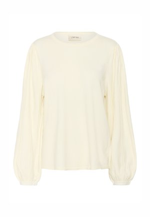 Kremowa bluzka z długim rękawem, z okrągłym dekoltem, teksturowanymi rękawami w kształcie balonu oraz miękkim wykończeniem materiału. Prosty, nieozdobiony design.