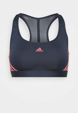 Sutiã desportivo azul-marinho com uma textura suave, design de costas nadador, logo rosa e detalhe de faixas laterais. Feito de material respirável e elástico.