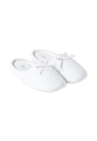 Pantofole bianche con un motivo floreale, in morbido tessuto, con punta arrotondata e piccoli fiocchi su ciascun superiore. Design slip-on, interno accogliente.