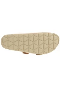 Beige rubberen schoenzool met een gestructureerd, geometrisch patroon en zachte bruine accenten, ontworpen voor duurzaamheid en grip.
