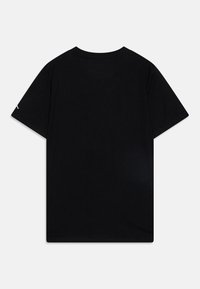 Black cotton t-shirt with short sleeves, standard crew neck, smooth texture, and a simple design featuring a white logo on the sleeve.