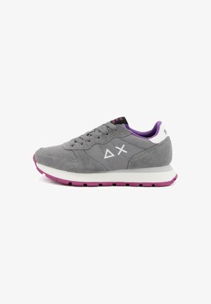 Gray suede sneaker with a flat white midsole and purple outsole. Features a mesh tongue, gray laces, and white logo accents on the sides.